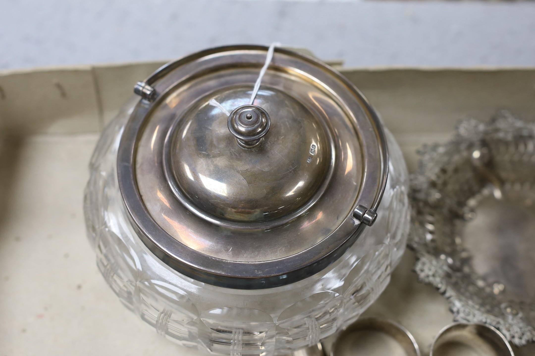 A George V silver mounted glass bowl and cover and other sundry silver including napkin rings, vesta case and condiments.